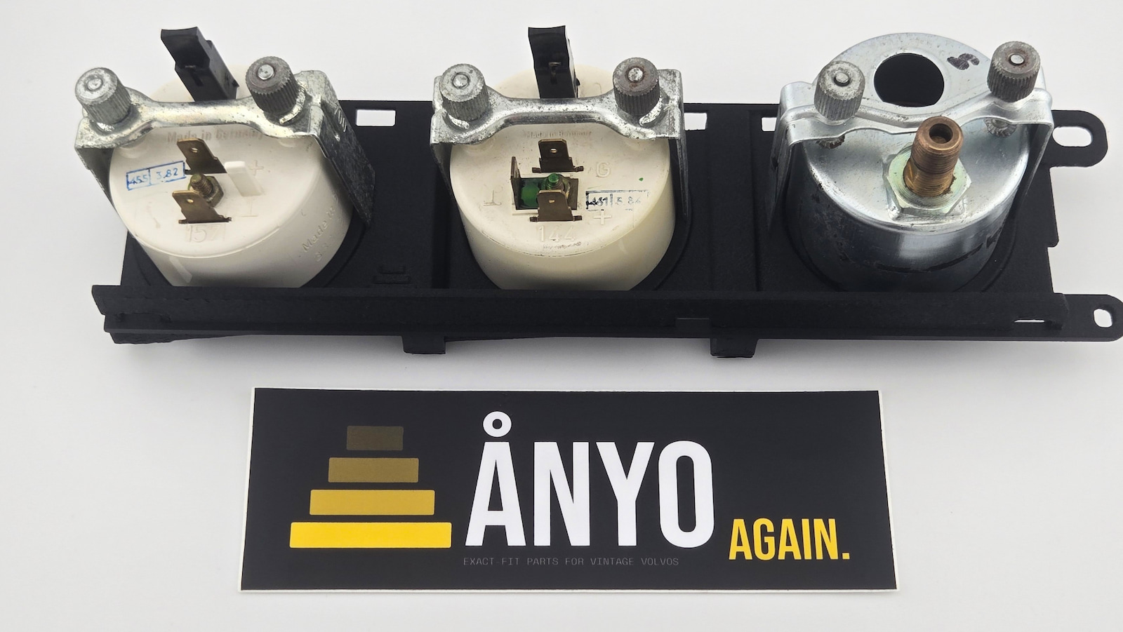 Volvo 240 triple gauge bracket rear view showing gauges secured with factory-style clamps