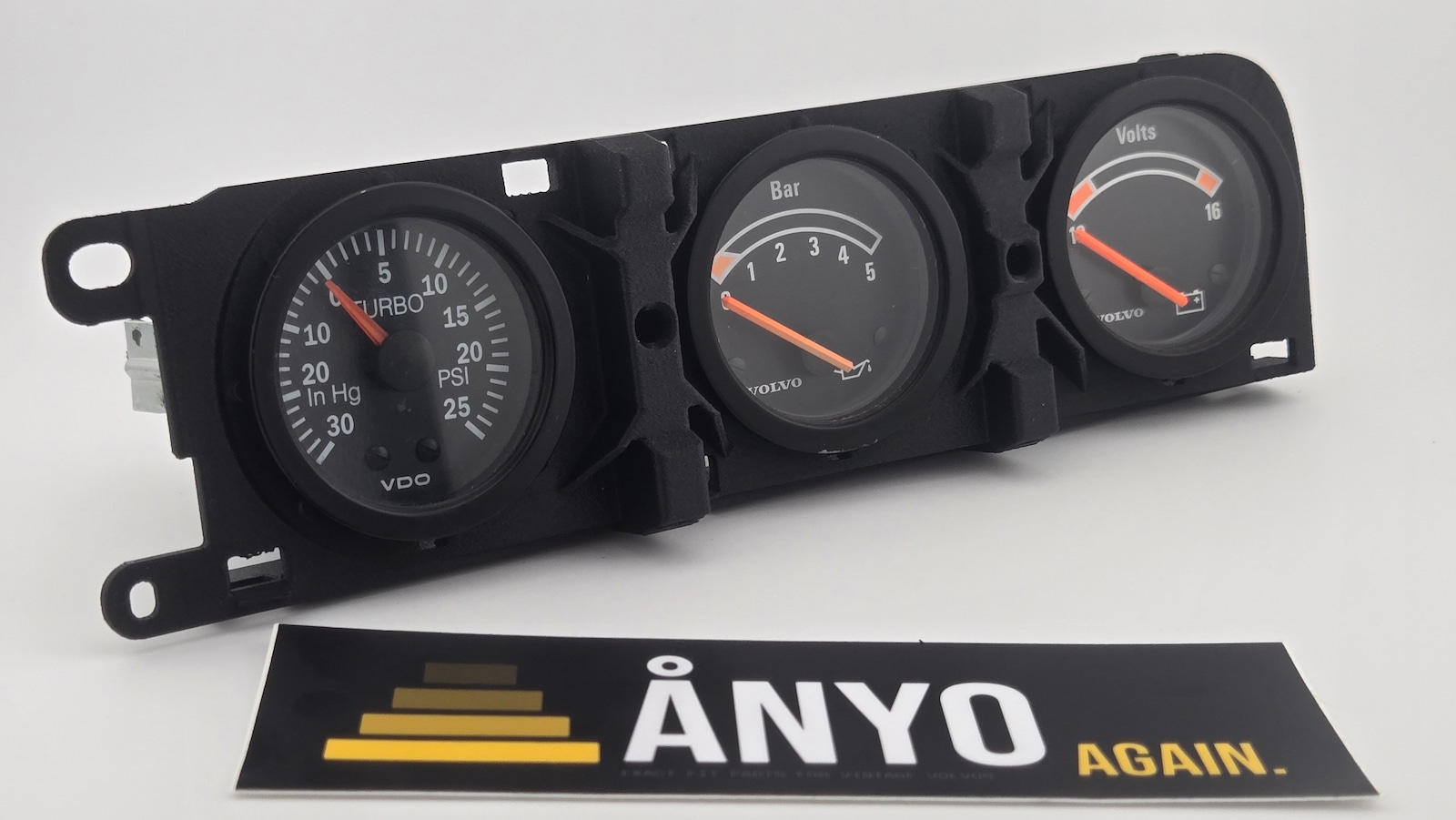 Volvo 240 triple gauge bracket with boost, oil pressure, and volt gauges — angled view
